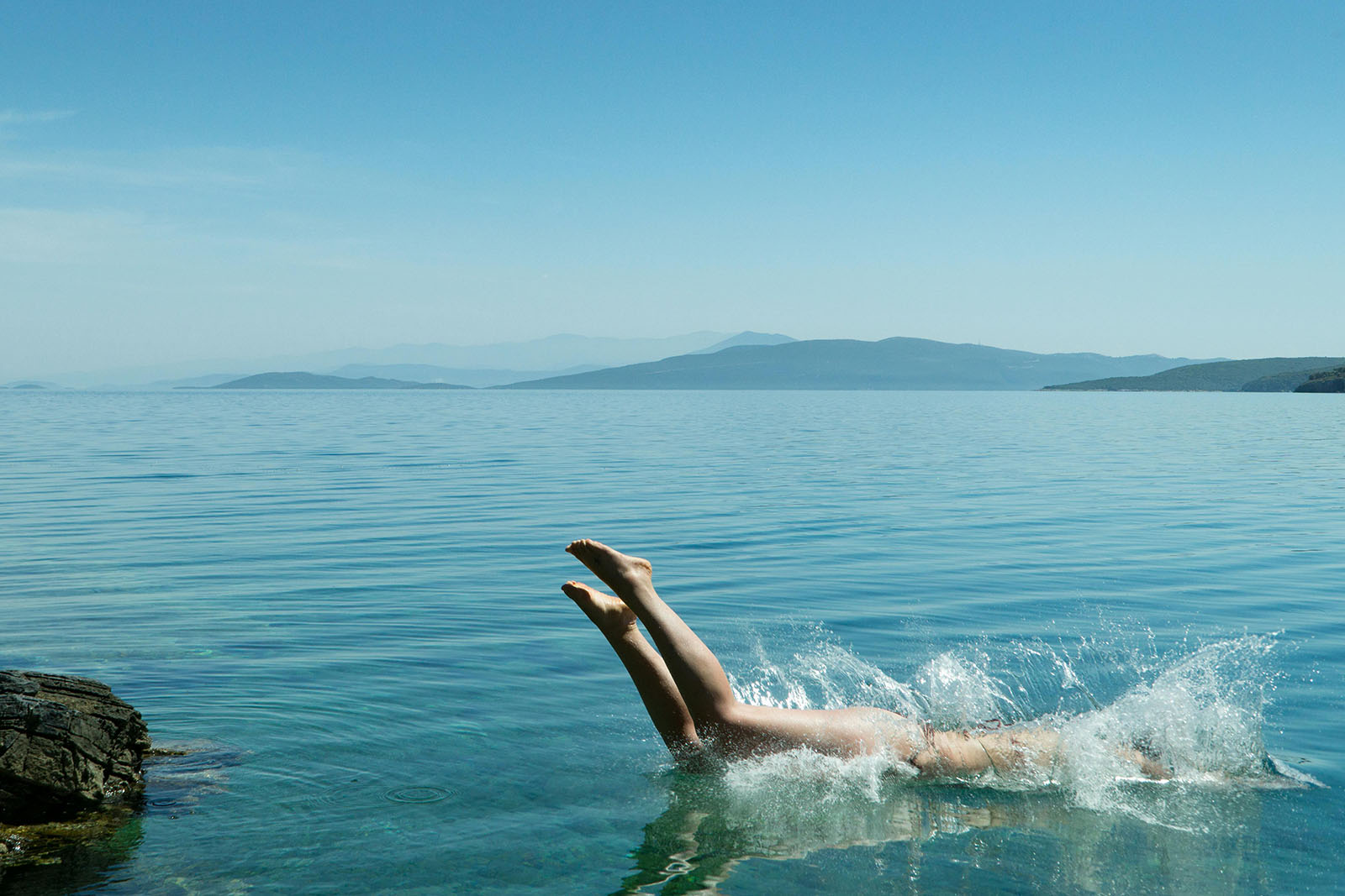 swimmer diving into river