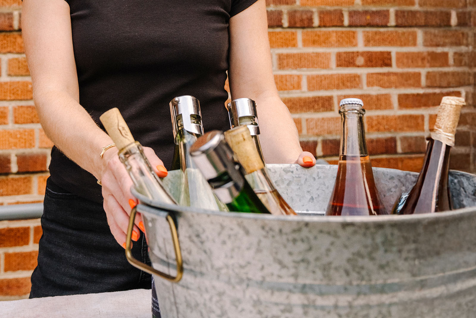 Woman behind ice bucket of wine