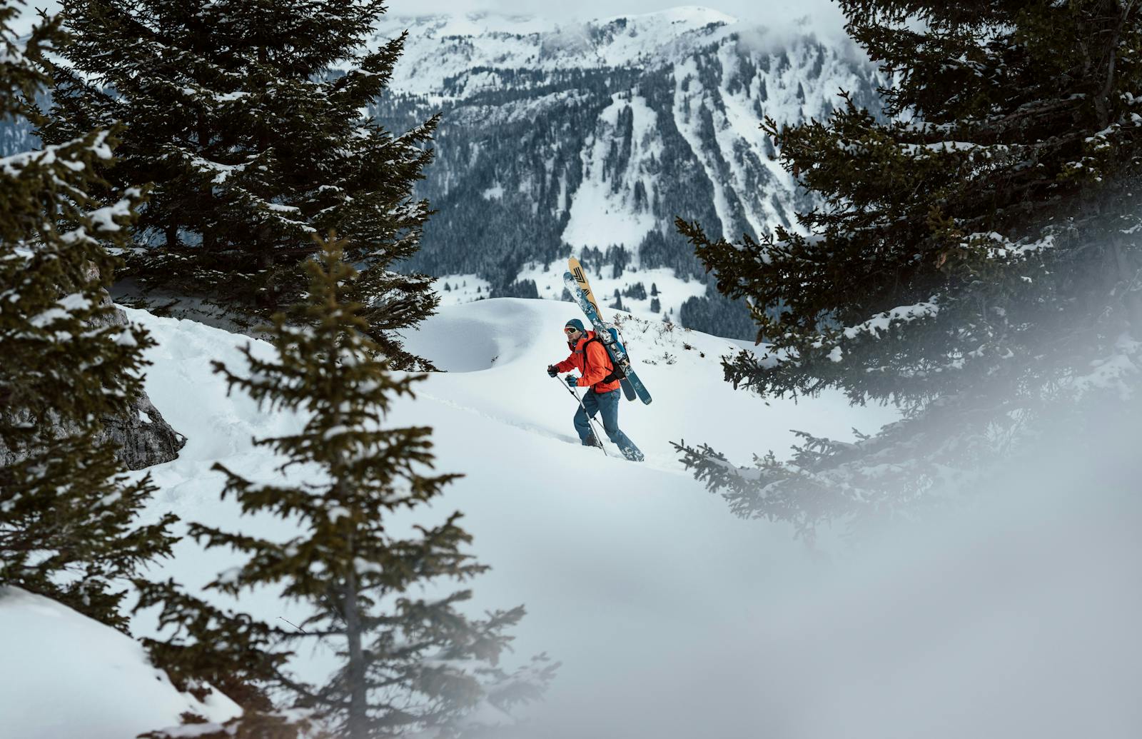 Backcountry skier hiking up a snowy mt. adams slope