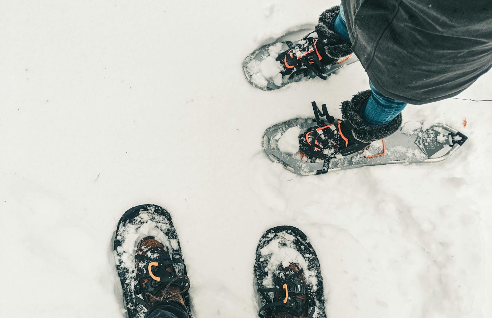 downward facing shot of two sets of snowshoes at mt. adams